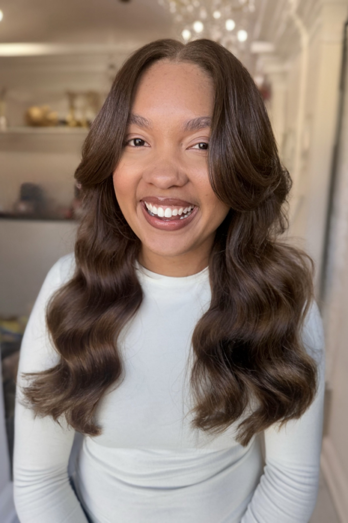 Facing front of the camera showing off Go Sleek Human Hair bundles in Light Brown